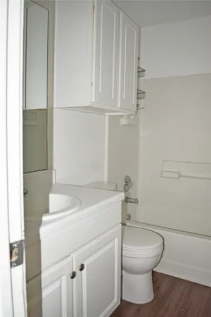 a bathroom with a sink a toilet and vanity
