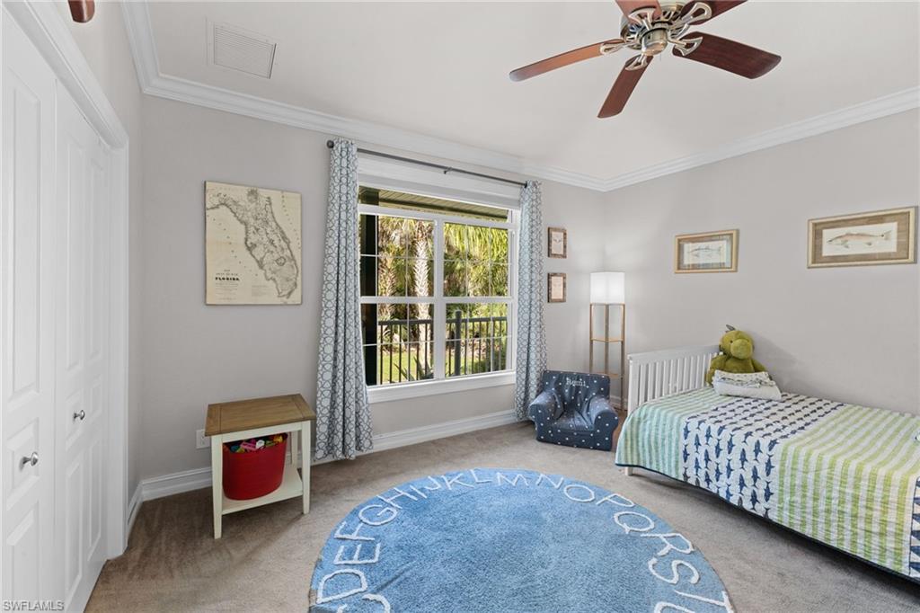 911 Mingo Drive Naples, FL 34120 - Photo 16 of 50 a bedroom with furniture and a window