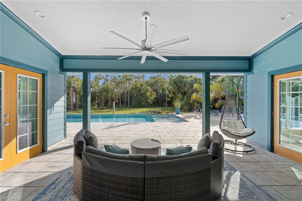 911 Mingo Drive Naples, FL 34120 - Photo 24 of 50 a living room with large window