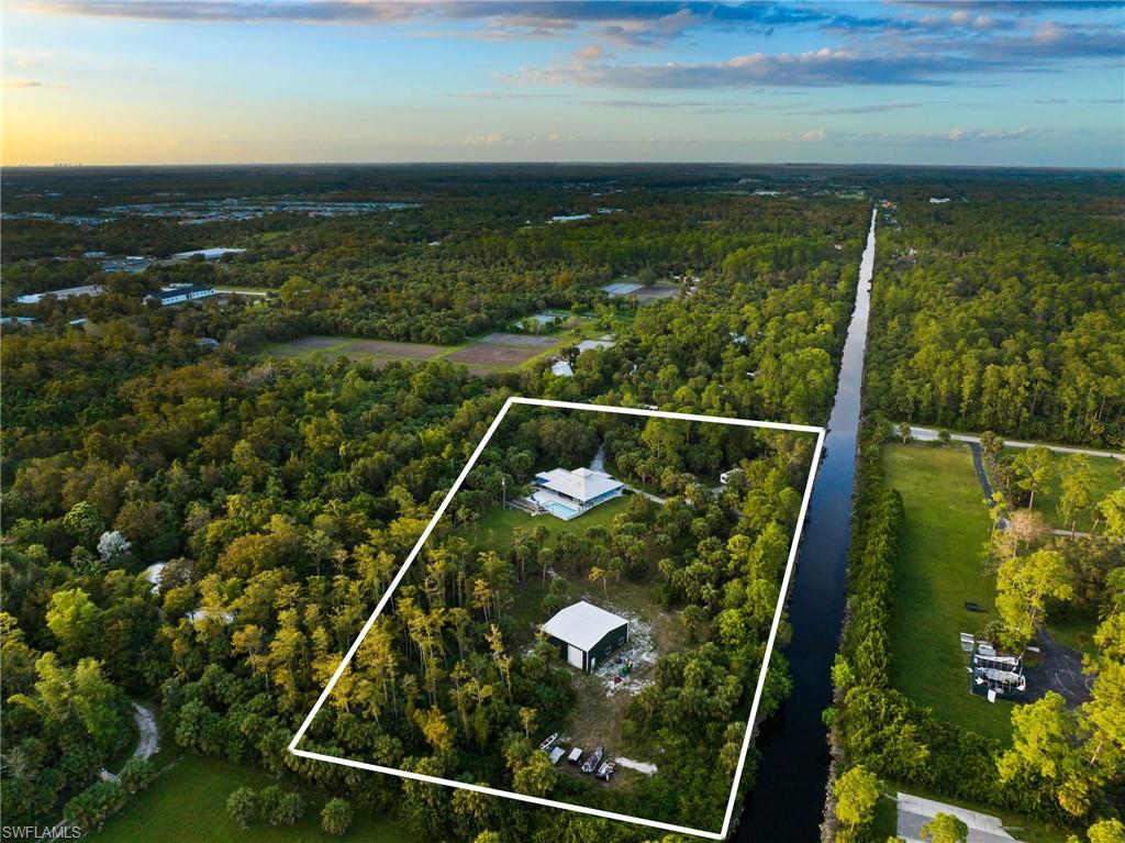 911 Mingo Drive Naples, FL 34120 - Photo 44 of 50 a view of a lake from a balcony