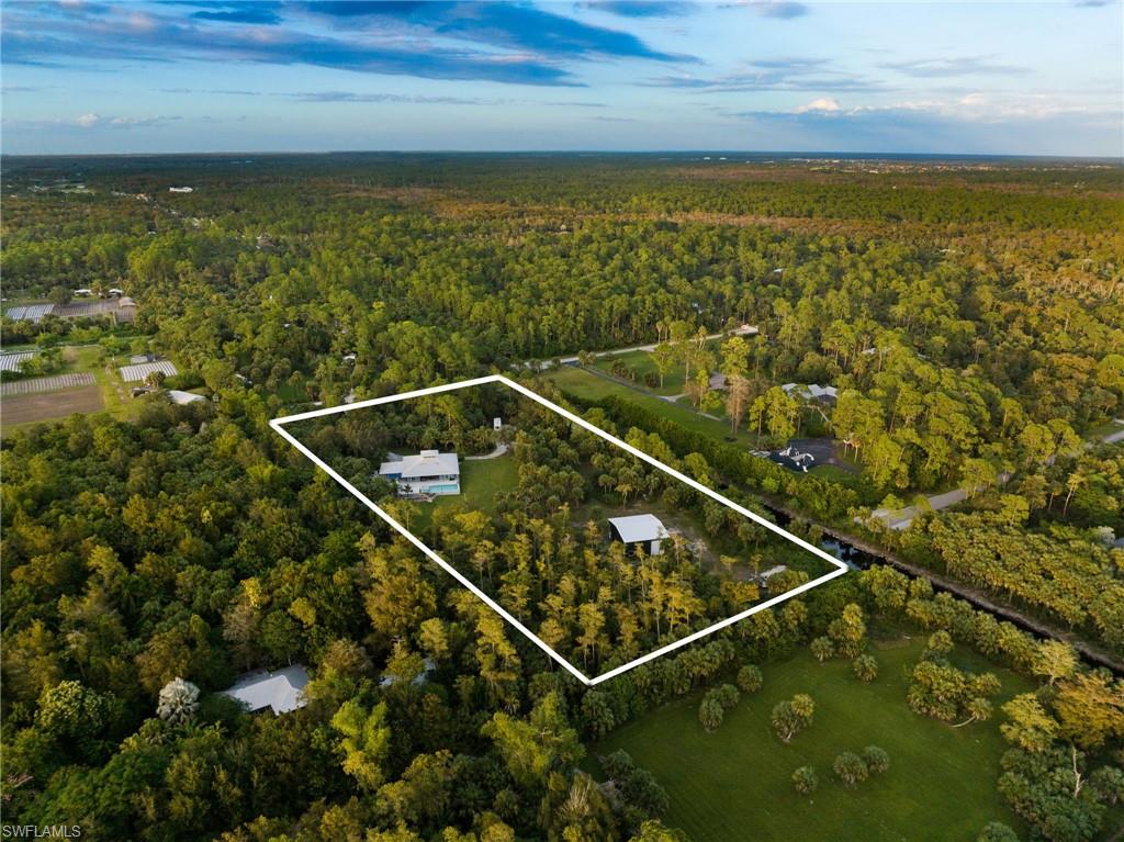 911 Mingo Drive Naples, FL 34120 - Photo 46 of 50 a view of a tennis court