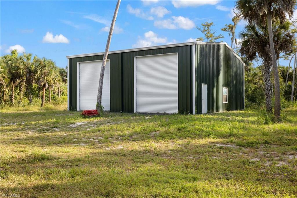 911 Mingo Drive Naples, FL 34120 - Photo 5 of 50 a backyard of a house