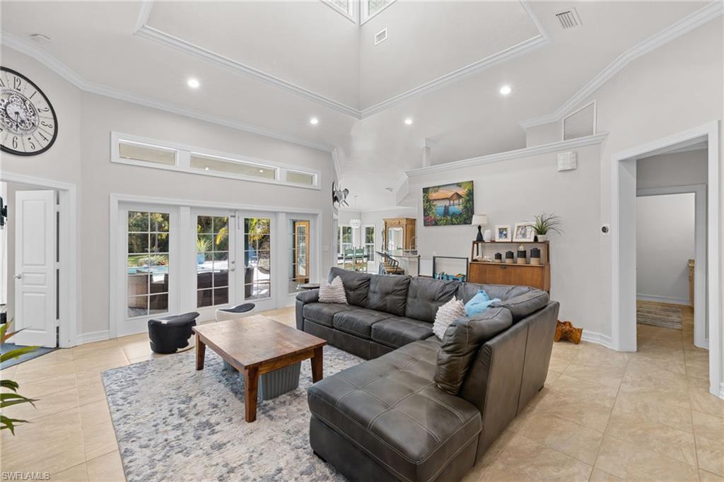 911 Mingo Drive Naples, FL 34120 - Photo 9 of 50 a living room with furniture and a large window