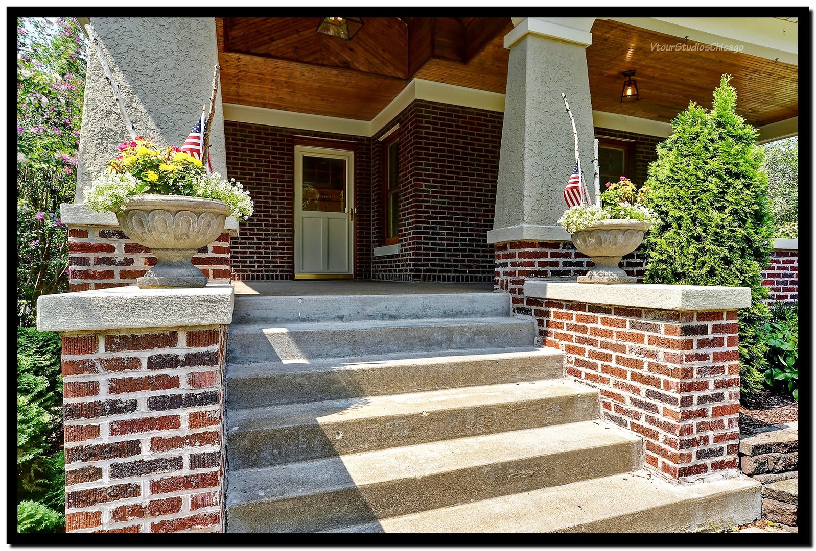 96 North Delaplaine Road Riverside, IL 60546 - Photo 2 of 25 a front view of a house with potted plants