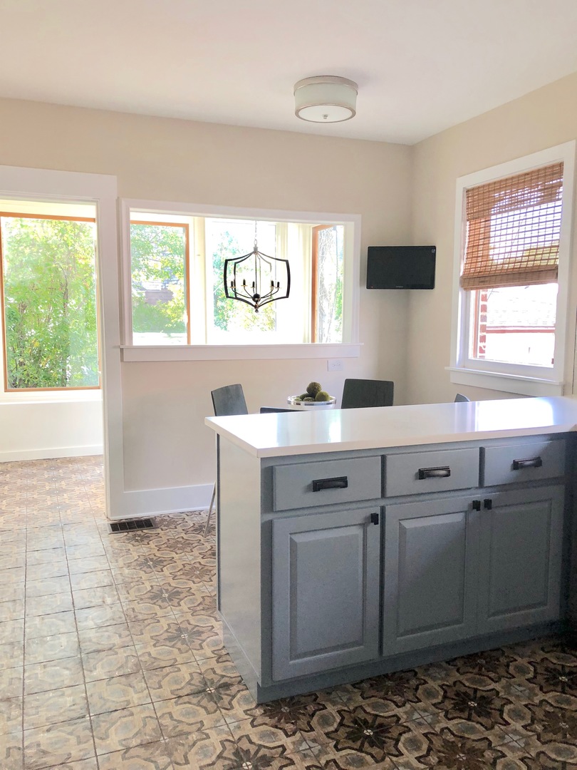 96 North Delaplaine Road Riverside, IL 60546 - Photo 12 of 25 a view of a sink a window and a kitchen