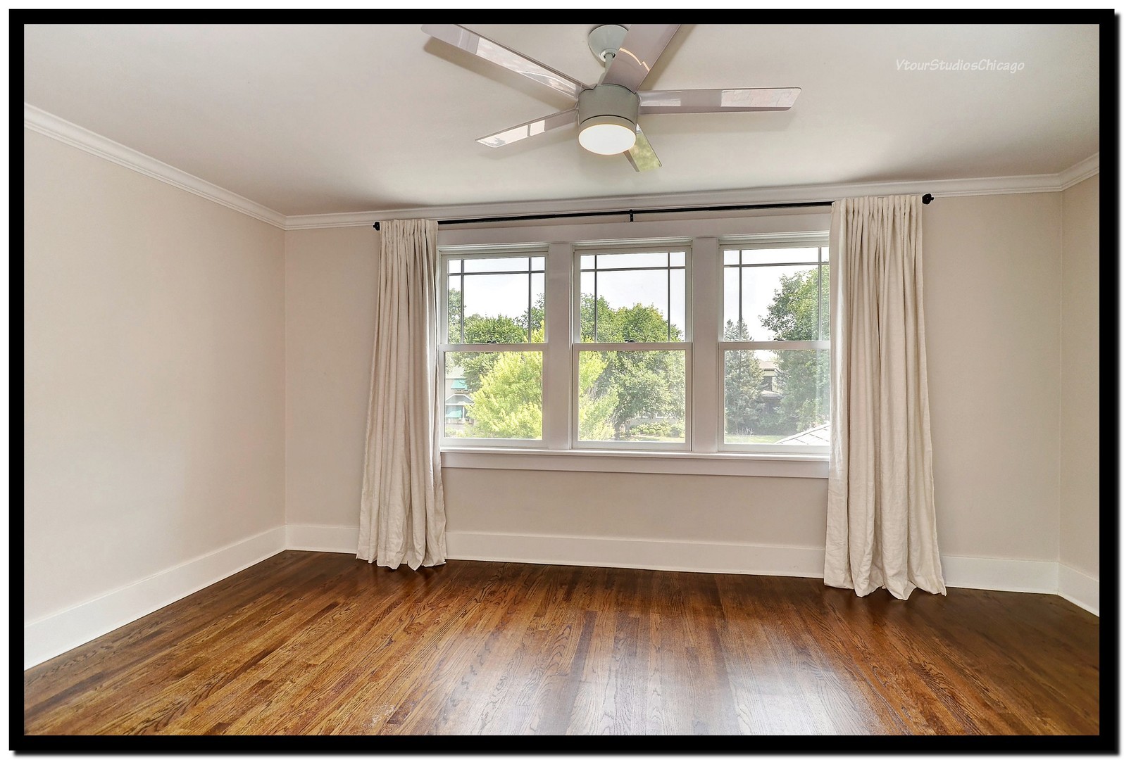 96 North Delaplaine Road Riverside, IL 60546 - Photo 21 of 25 an empty room with wooden floor and windows