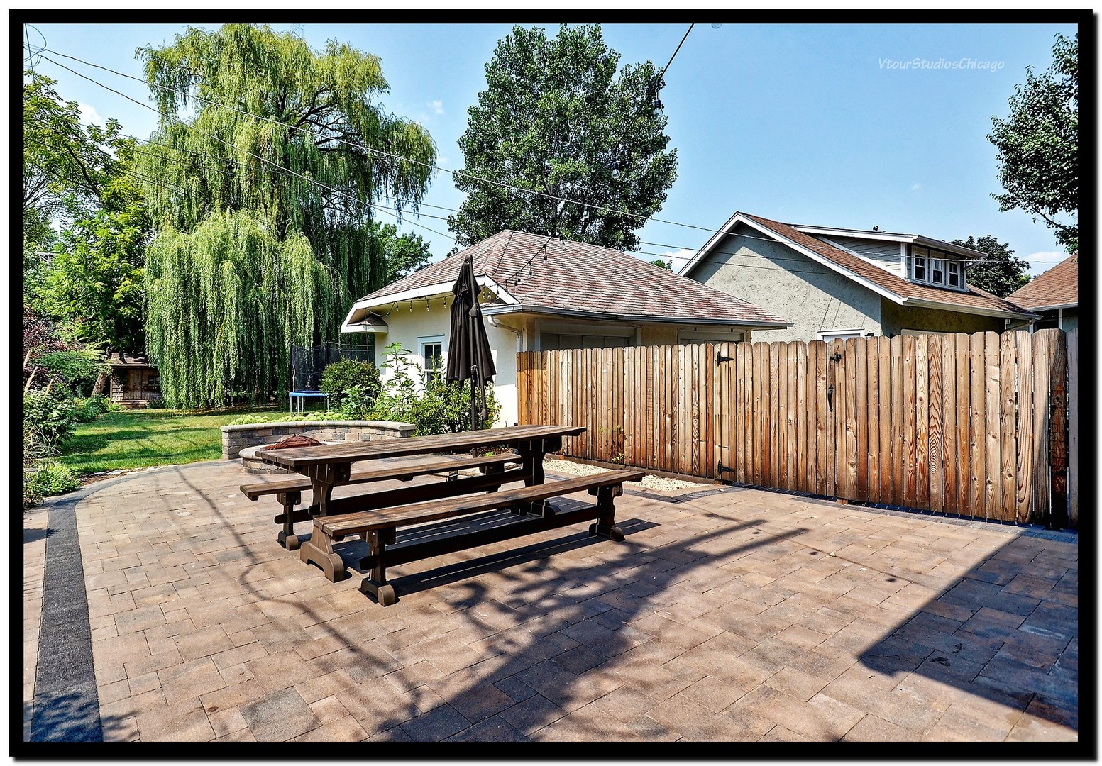 96 North Delaplaine Road Riverside, IL 60546 - Photo 22 of 25 a backyard of a house with barbeque oven table and chairs