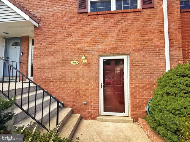 a view of front door of house with stairs