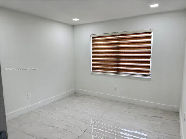 a bathroom with a toilet a sink and shower