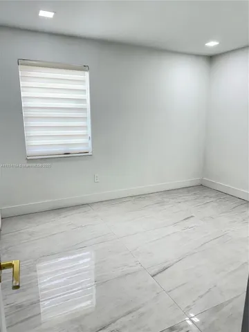an empty room with closet area