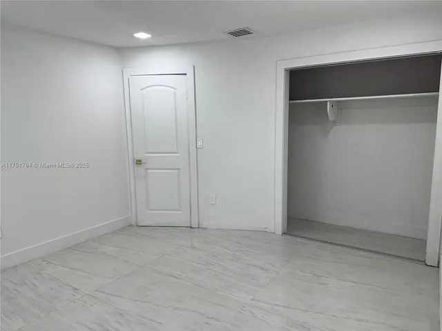 a kitchen with a stove and a refrigerator