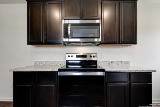 a kitchen with a sink and a microwave