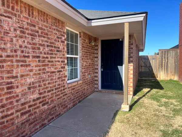 a view of front door of house with stairs