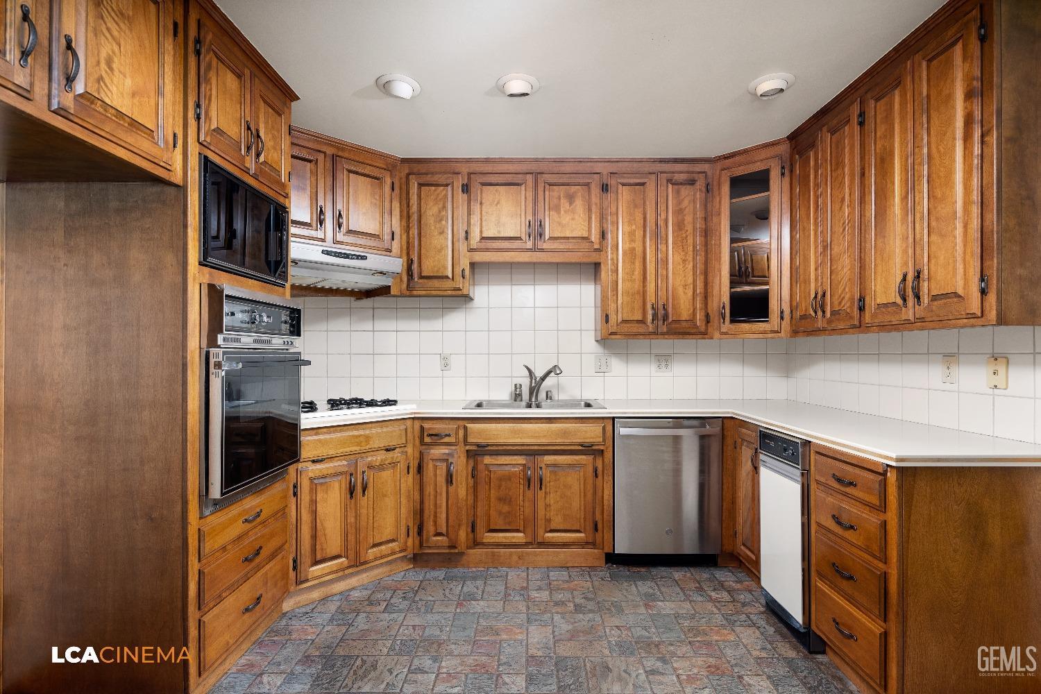 Undisclosed Address Shafter, CA 93263 - Photo 13 of 19 a kitchen with stainless steel appliances granite countertop a sink stove and cabinets