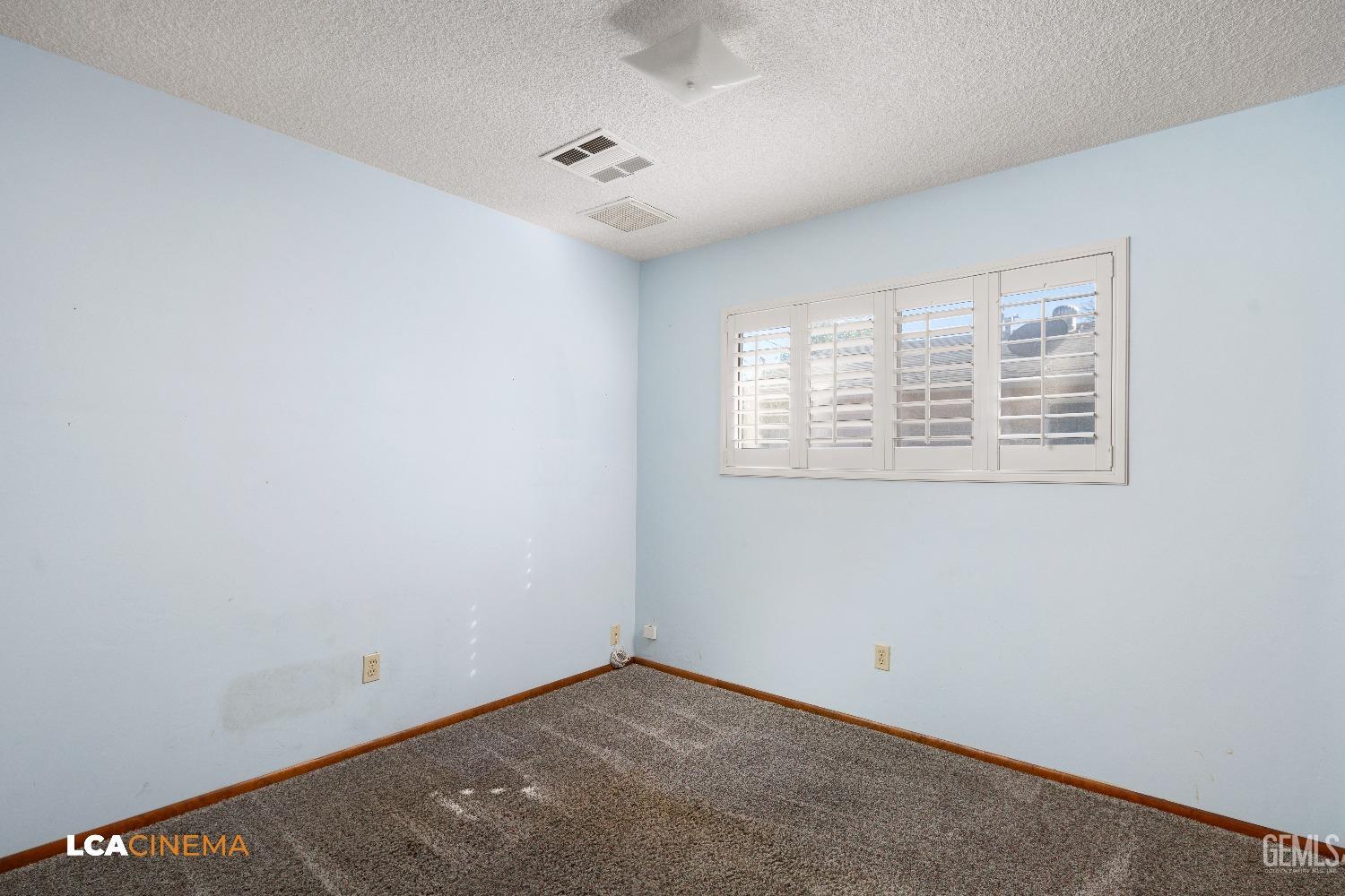 Undisclosed Address Shafter, CA 93263 - Photo 14 of 19 a view of an empty room with a window