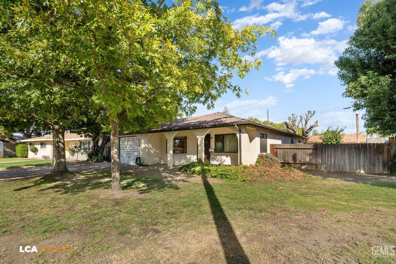 Undisclosed Address Shafter, CA 93263 - Photo 3 of 19 a front view of a house with a yard