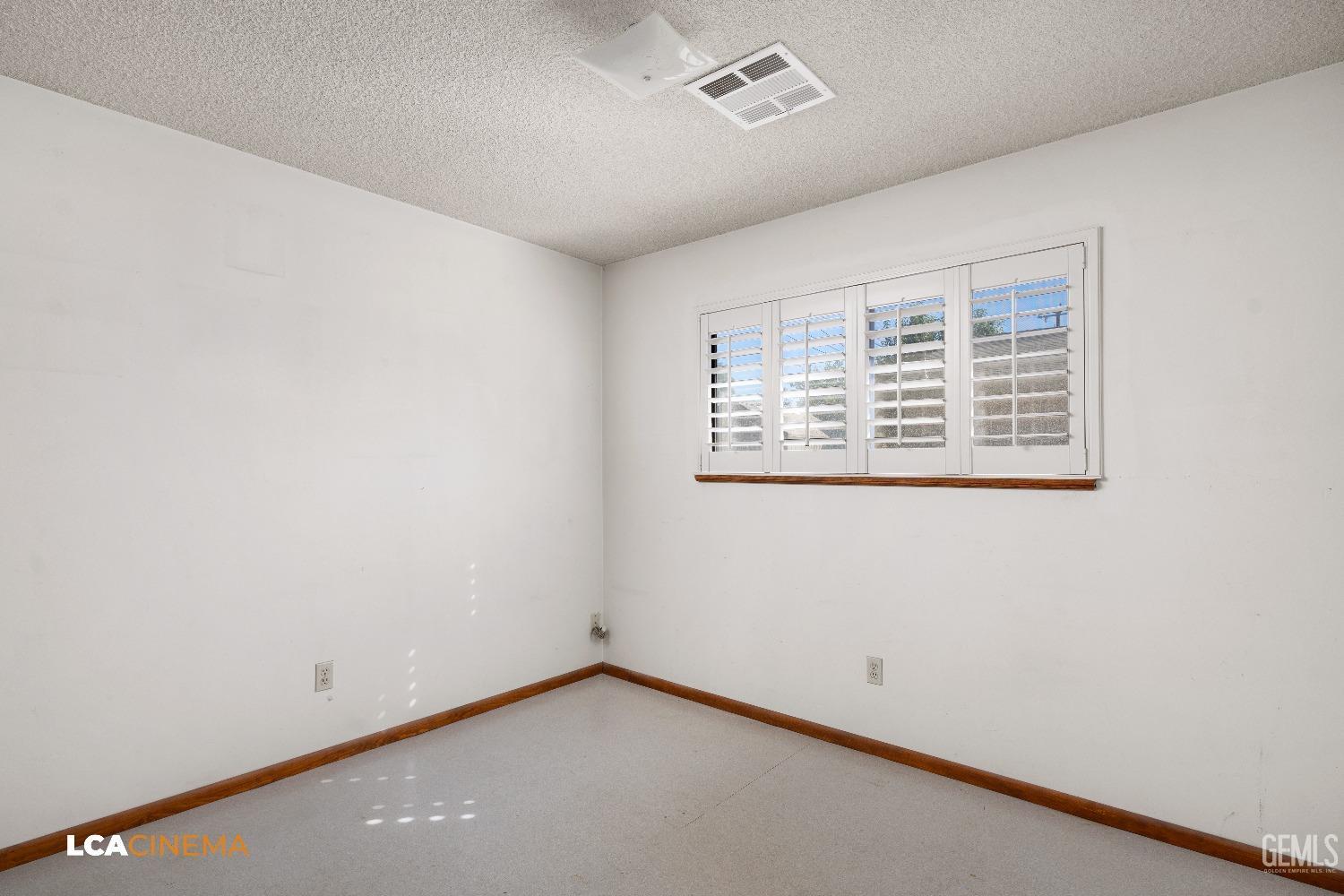 Undisclosed Address Shafter, CA 93263 - Photo 5 of 19 an empty room with a empty space and window
