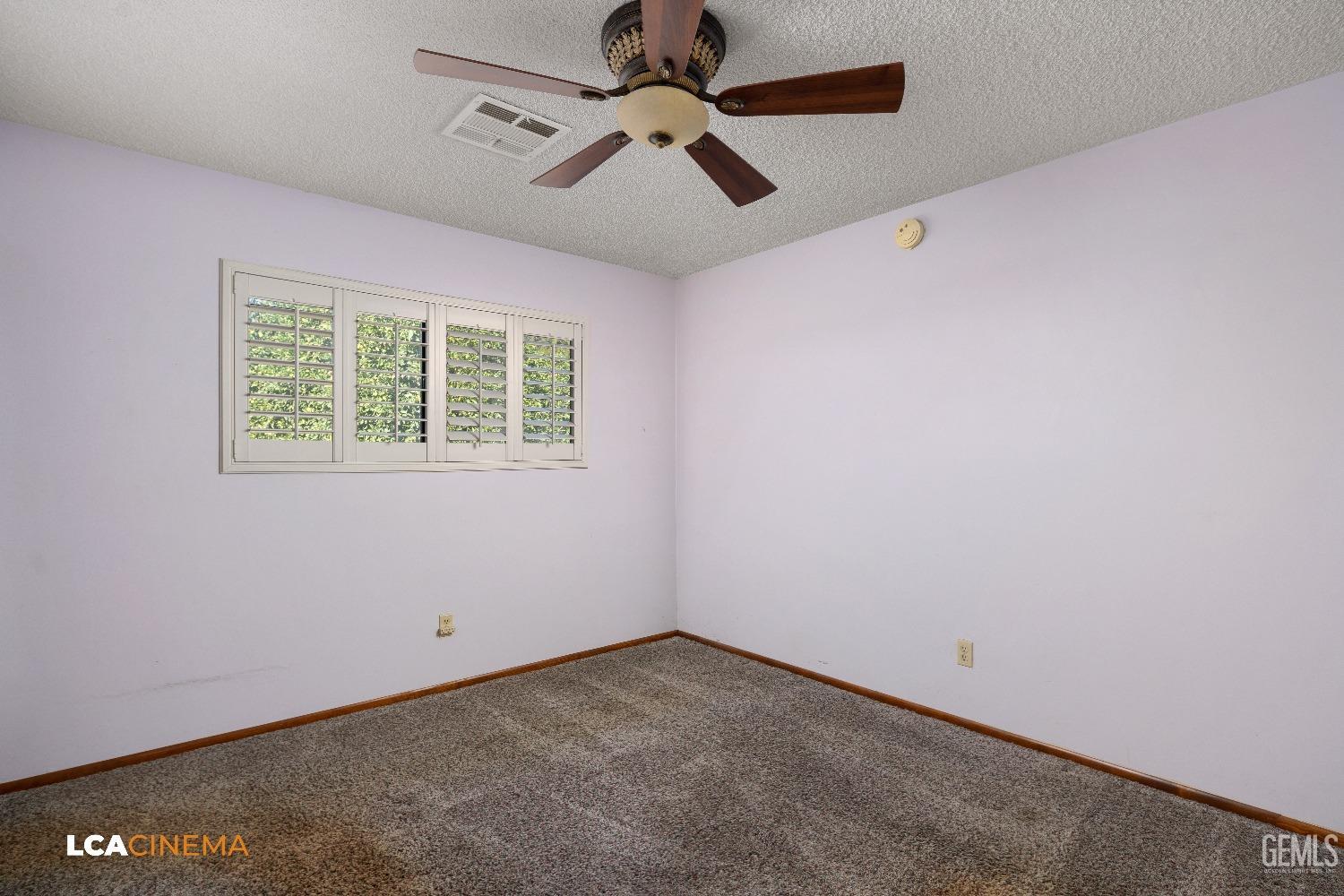 Undisclosed Address Shafter, CA 93263 - Photo 6 of 19 an empty room with a window and a fan