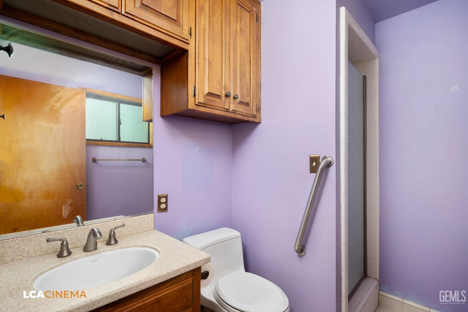 Undisclosed Address Shafter, CA 93263 - Photo 8 of 19 a bathroom with a sink toilet and vanity