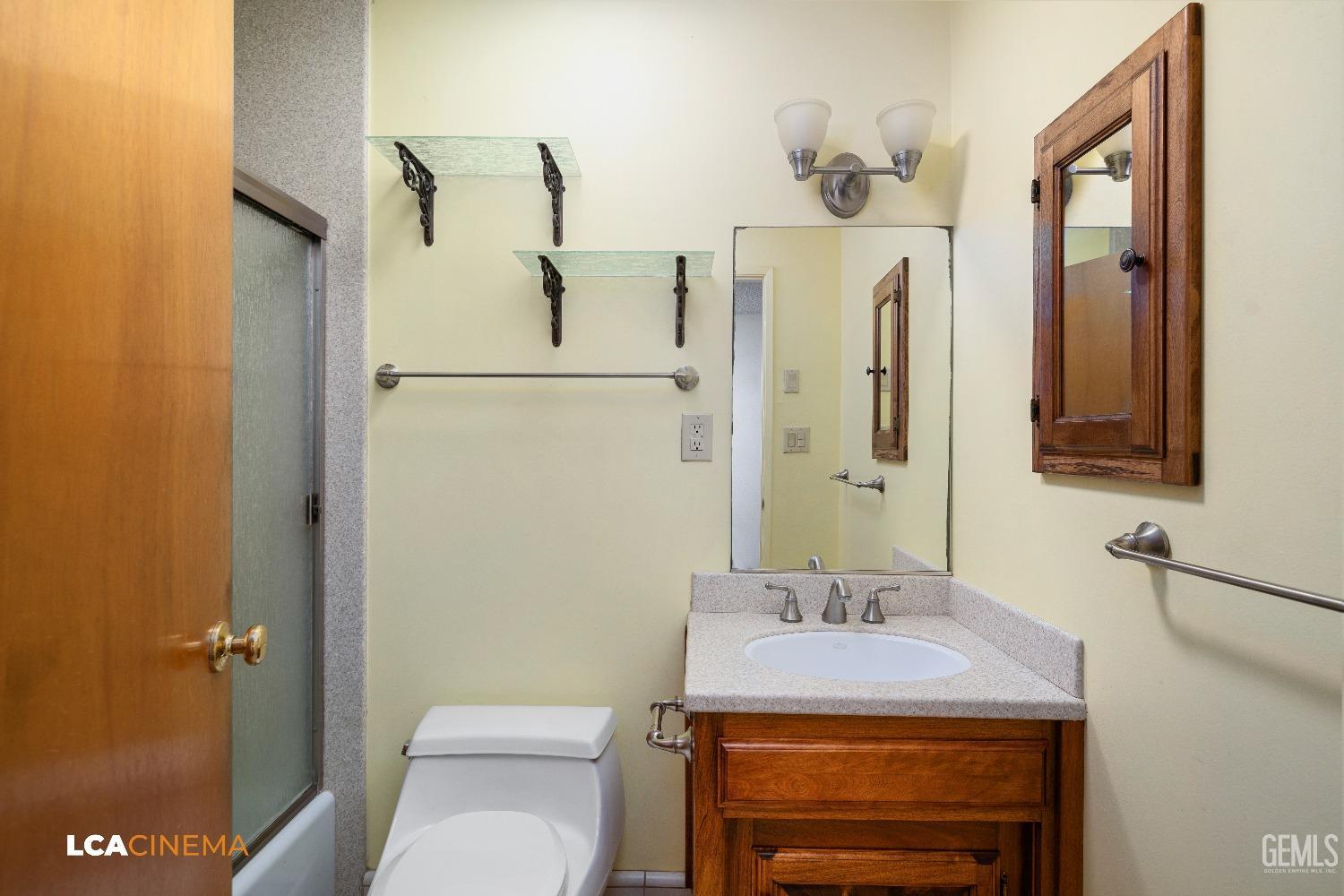 Undisclosed Address Shafter, CA 93263 - Photo 9 of 19 a bathroom with a sink a toilet and shower