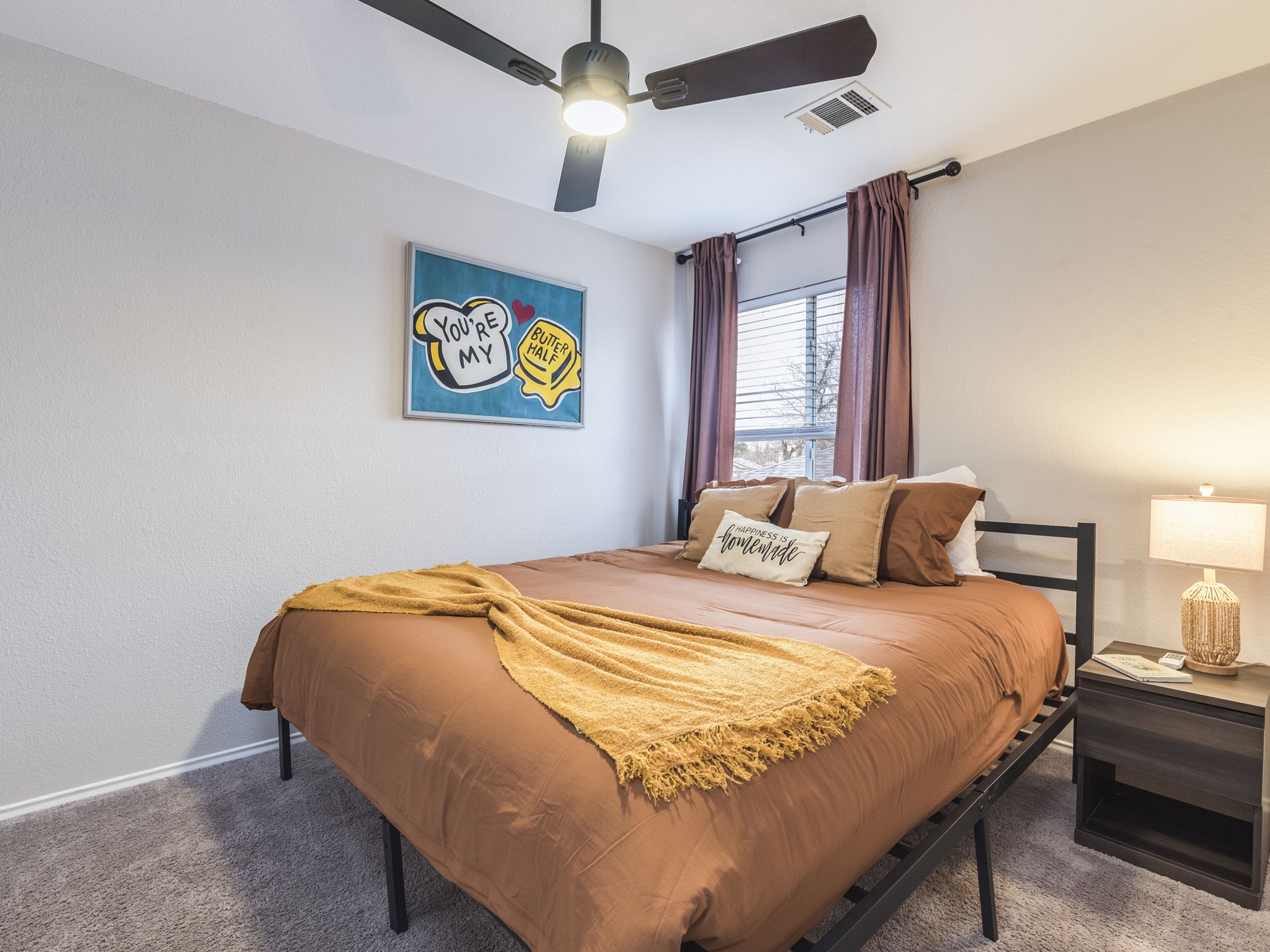 1415 Roxanne's Run Pflugerville, TX 78660 - Photo 23 of 30 Comfortable bedroom featuring soft carpet and a convenient ceiling fan for ultimate relaxation.