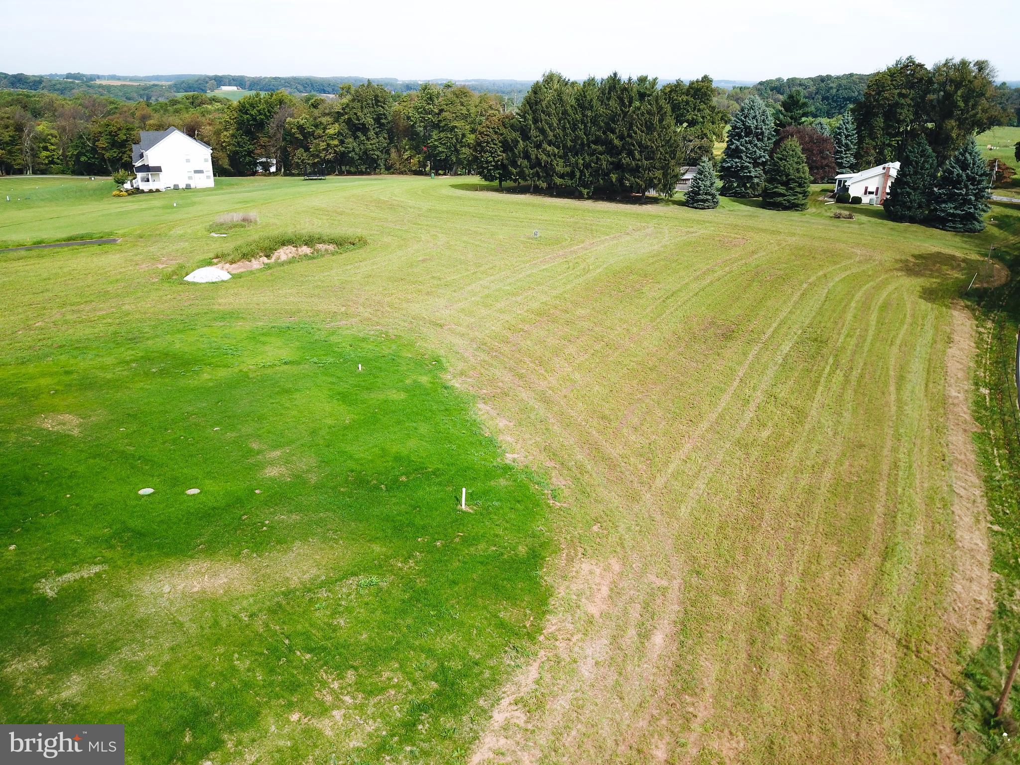 3911 Baker Road Westminster, MD 21157 - Photo 5 of 6 a view of a grassy area with an trees