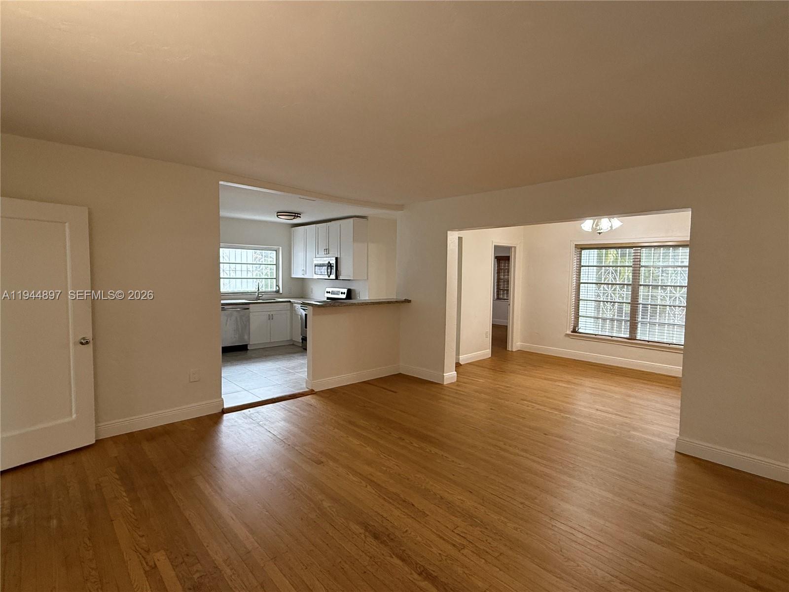 2151 Southwest 21st Terrace Miami, FL 33145 - Photo 5 of 22 a view of a kitchen with wooden floor and a kitchen