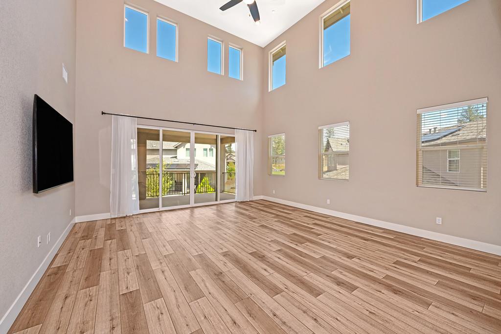 504 Chase Court Colfax, CA 95713 - Photo 40 of 94 a view of an empty room with wooden floor and a window