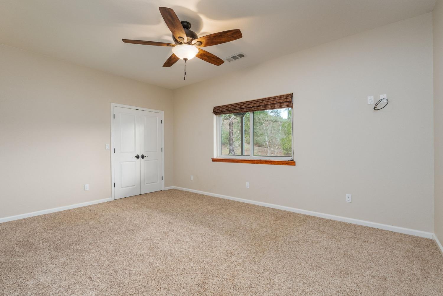 9080 El Dorado Trail Mountain Ranch, CA 95246 - Photo 32 of 48 a view of an empty room with a window
