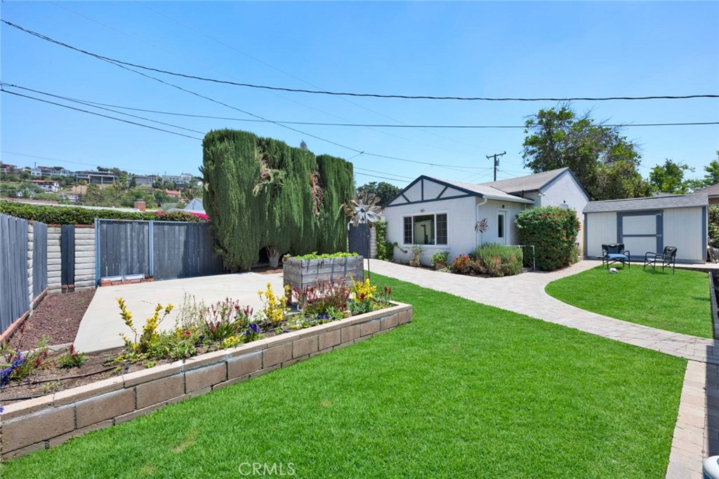 5456 Cadbury Road Whittier, CA 90601 - Photo 39 of 67 a front view of a house with garden