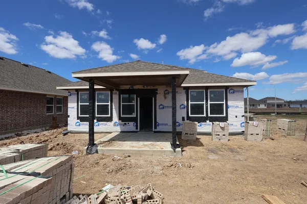 a view of a hallway with wooden floor and entryway