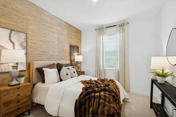 a kitchen with kitchen island granite countertop a table chairs microwave and cabinets