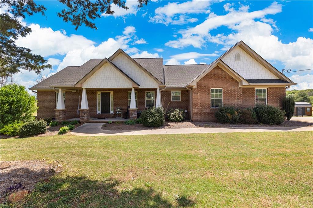 521 Adams Road Cedartown, GA 30125 - Photo 1 of 1 a front view of a house with yard and green space