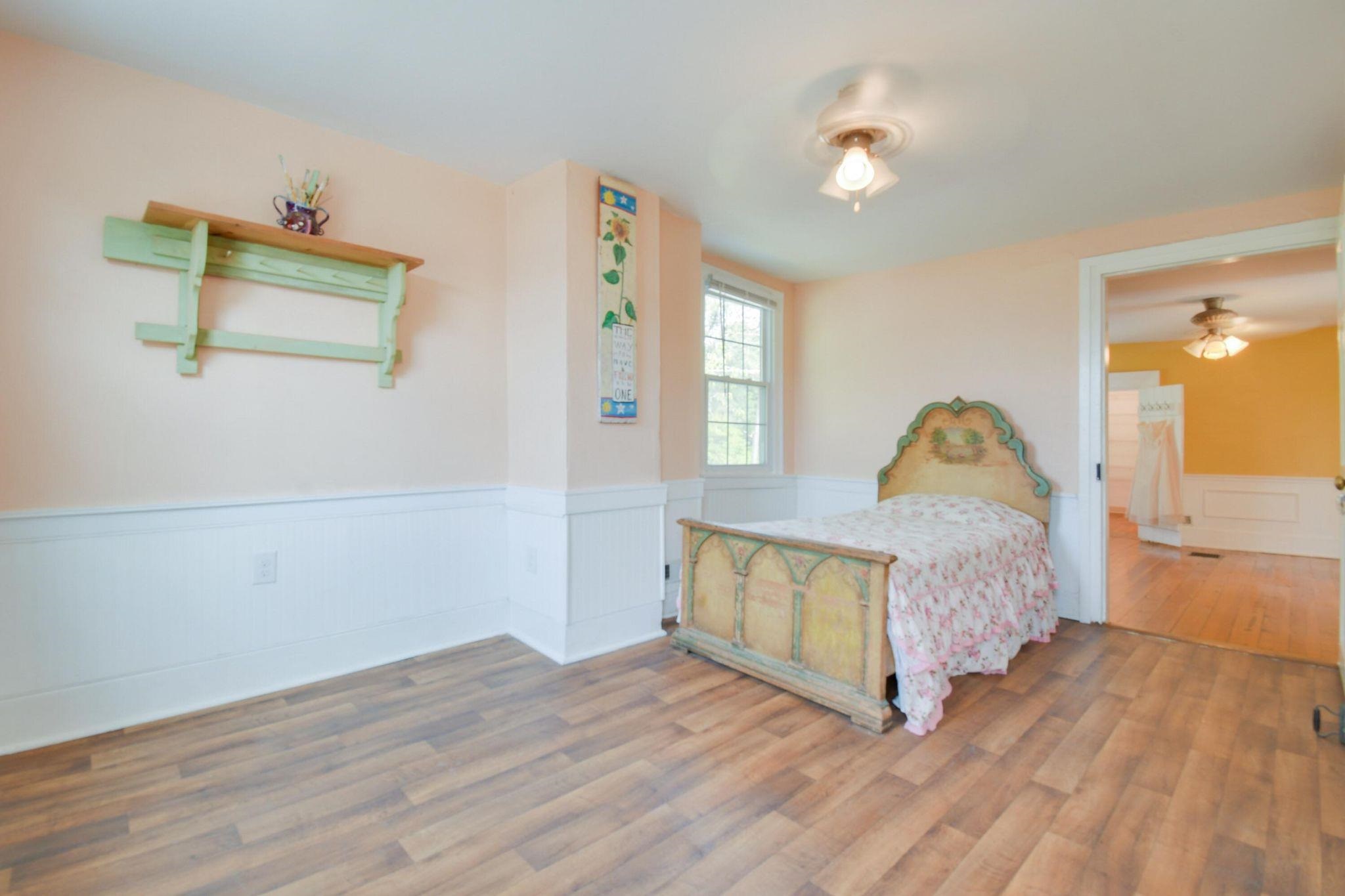 585 Battlefield Road New Hope, VA 24431 - Photo 21 of 49 a bedroom with a bed and window
