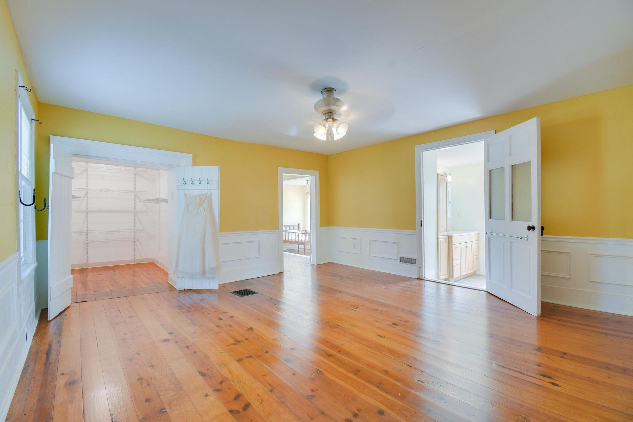 585 Battlefield Road New Hope, VA 24431 - Photo 23 of 49 a view of an empty room with wooden floor and a window