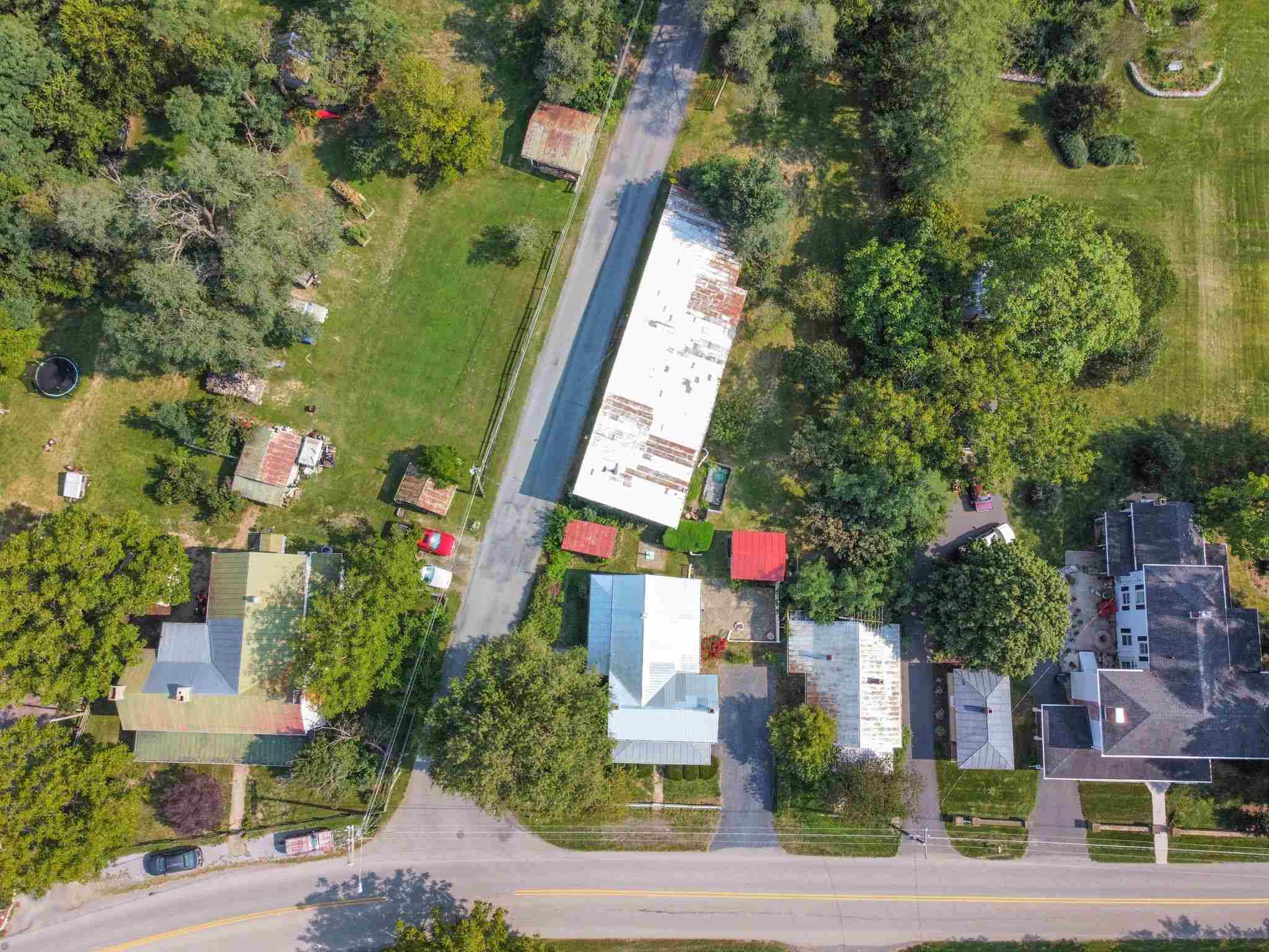585 Battlefield Road New Hope, VA 24431 - Photo 3 of 49 a multi story building with trees in front of it