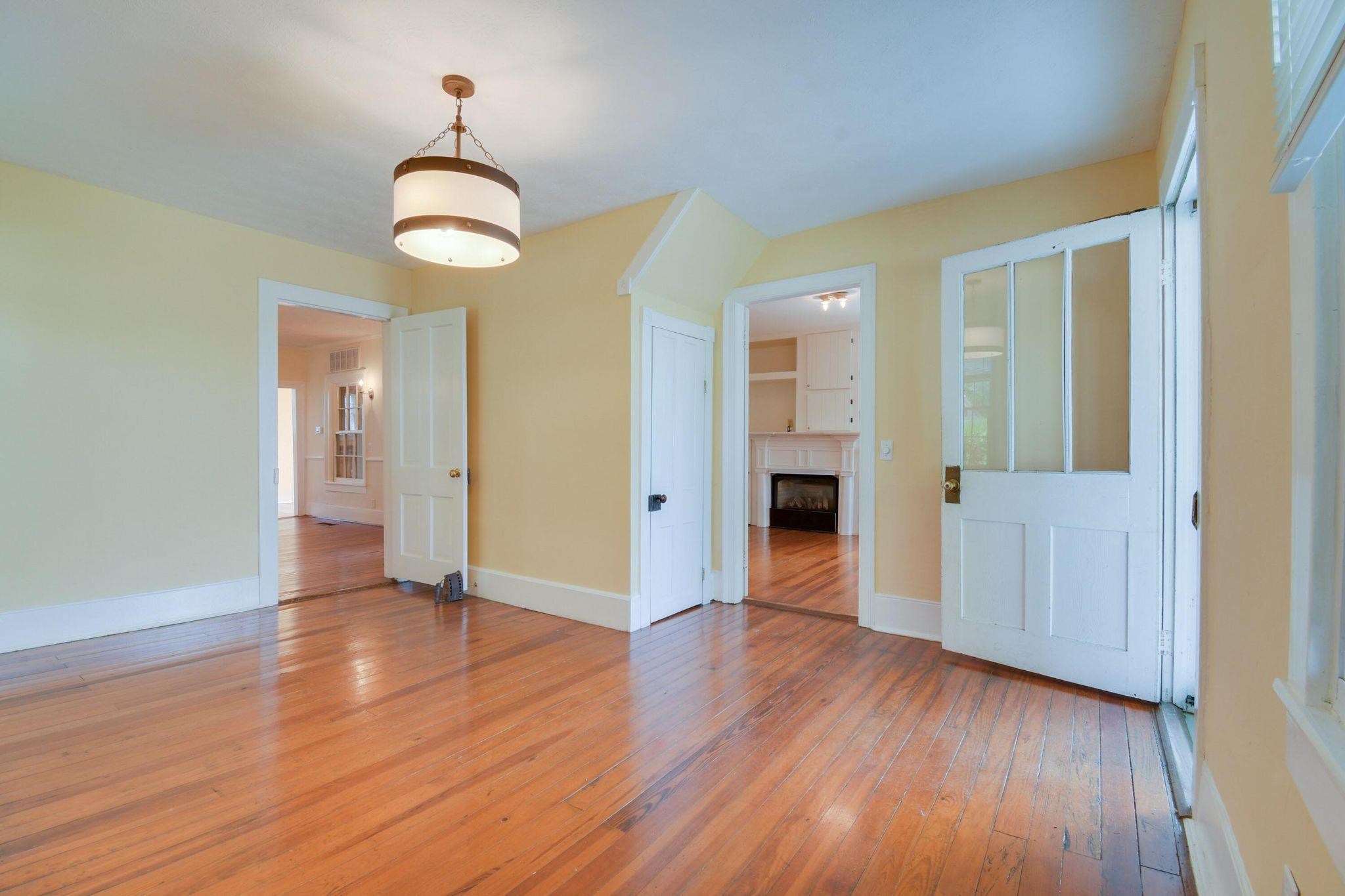 585 Battlefield Road New Hope, VA 24431 - Photo 8 of 49 wooden floor in an empty room with a window