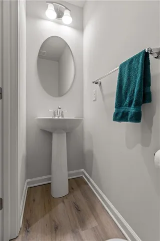 a bathroom with a sink and mirror