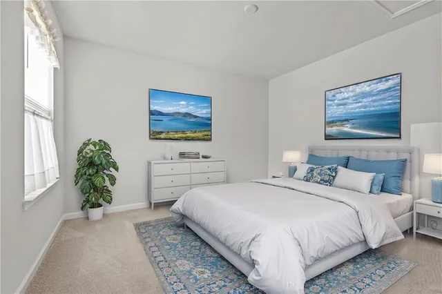 a bedroom with a bed and a couch