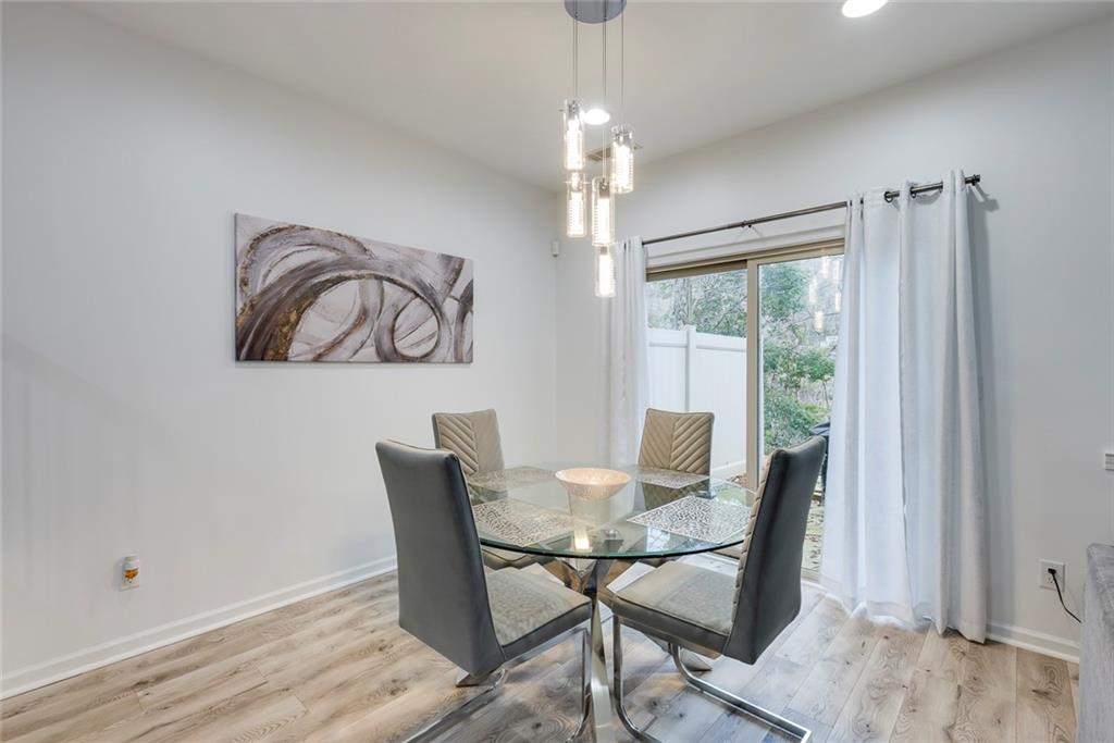 1561 Trailview Way Northeast Atlanta, GA 30329 - Photo 15 of 38 a view of a dining room with furniture window and outside view