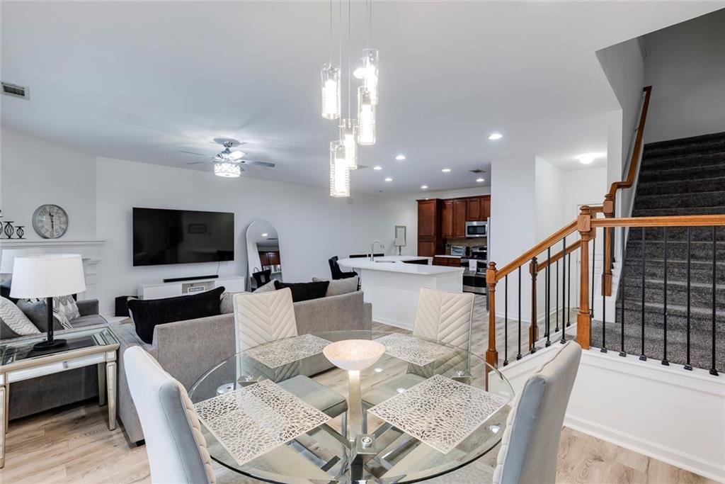 1561 Trailview Way Northeast Atlanta, GA 30329 - Photo 16 of 38 a living room with furniture kitchen view and a flat screen tv