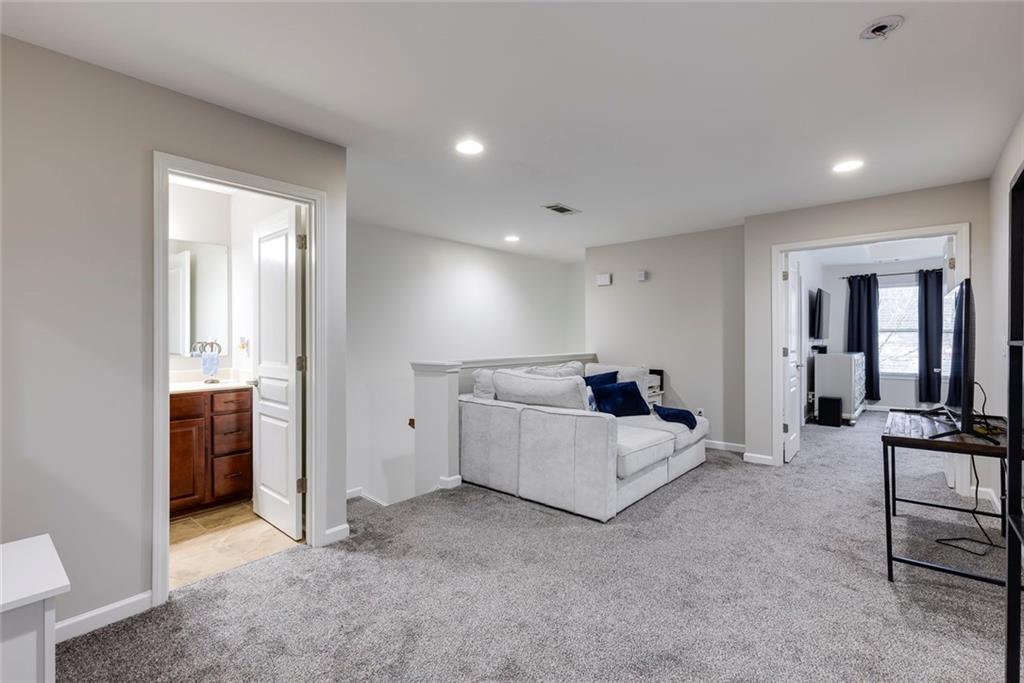 1561 Trailview Way Northeast Atlanta, GA 30329 - Photo 24 of 38 a bed room with furniture and mirror