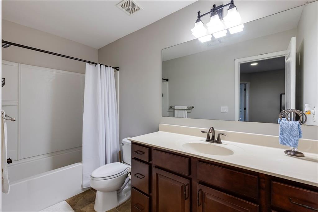 1561 Trailview Way Northeast Atlanta, GA 30329 - Photo 27 of 38 a bathroom with a sink toilet and shower