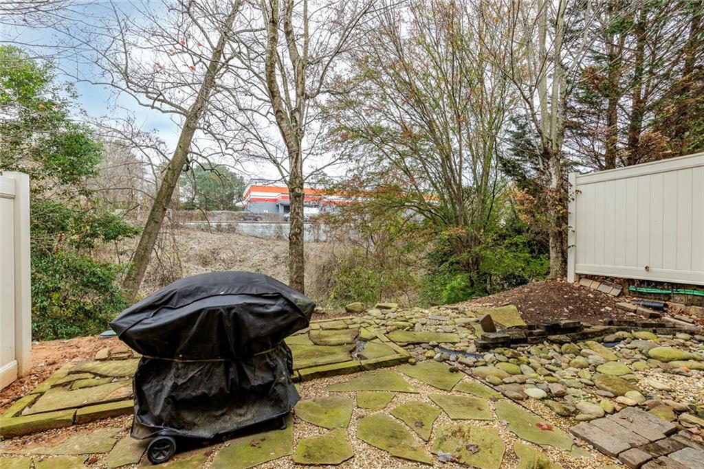 1561 Trailview Way Northeast Atlanta, GA 30329 - Photo 32 of 38 a view of backyard with barbeque grill and outdoor seating