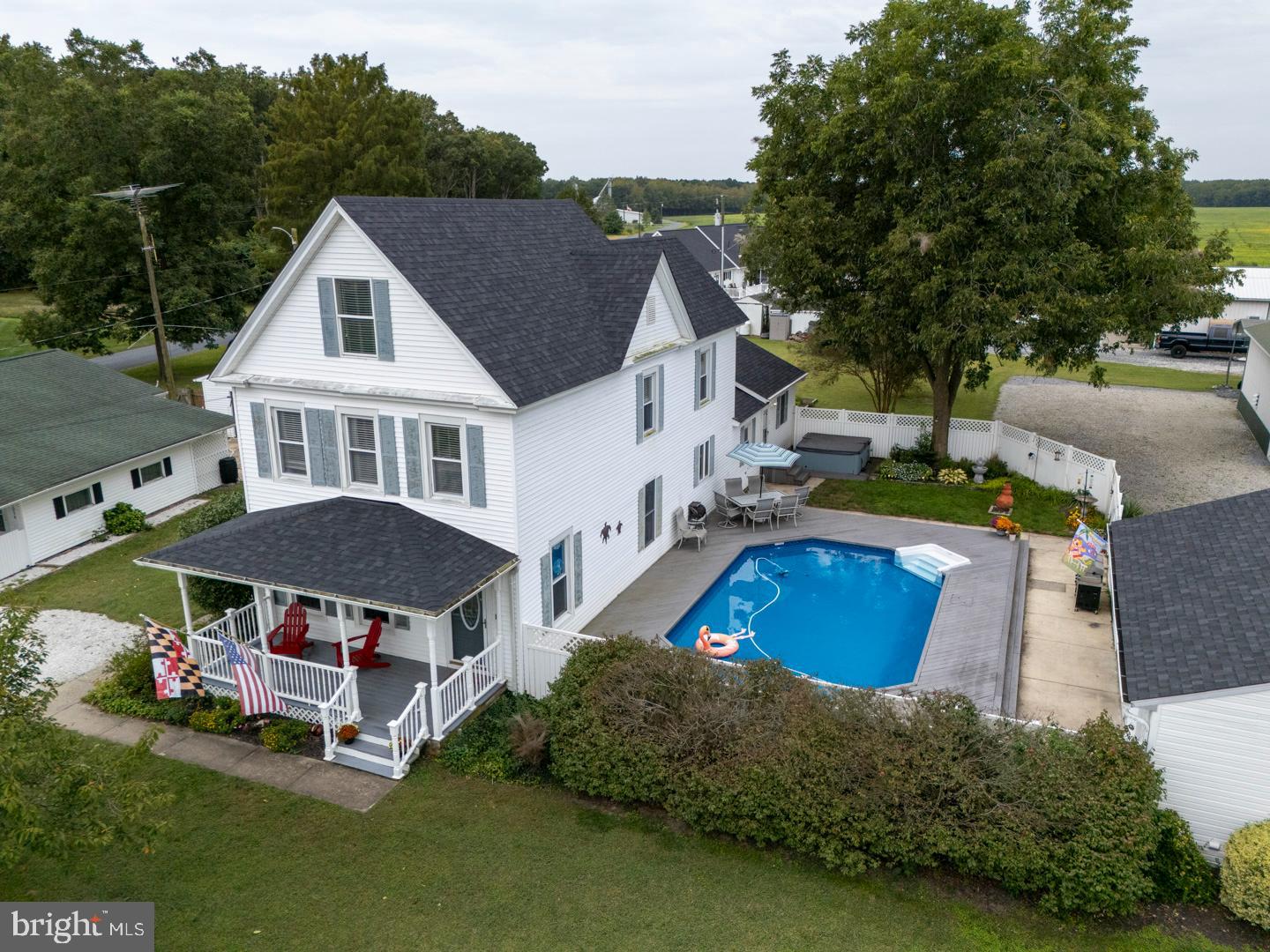4904 Ravenwood Road Vienna, MD 21869 - Photo 17 of 62 a aerial view of a house with swimming pool yard and outdoor seating