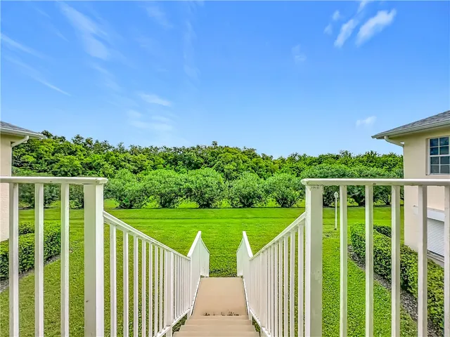 a view of balcony with wooden floor
