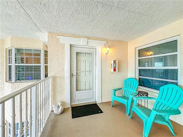 a view of a livingroom with furniture and a window