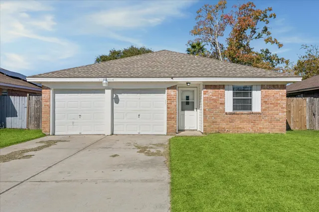 a front view of a house with a garage