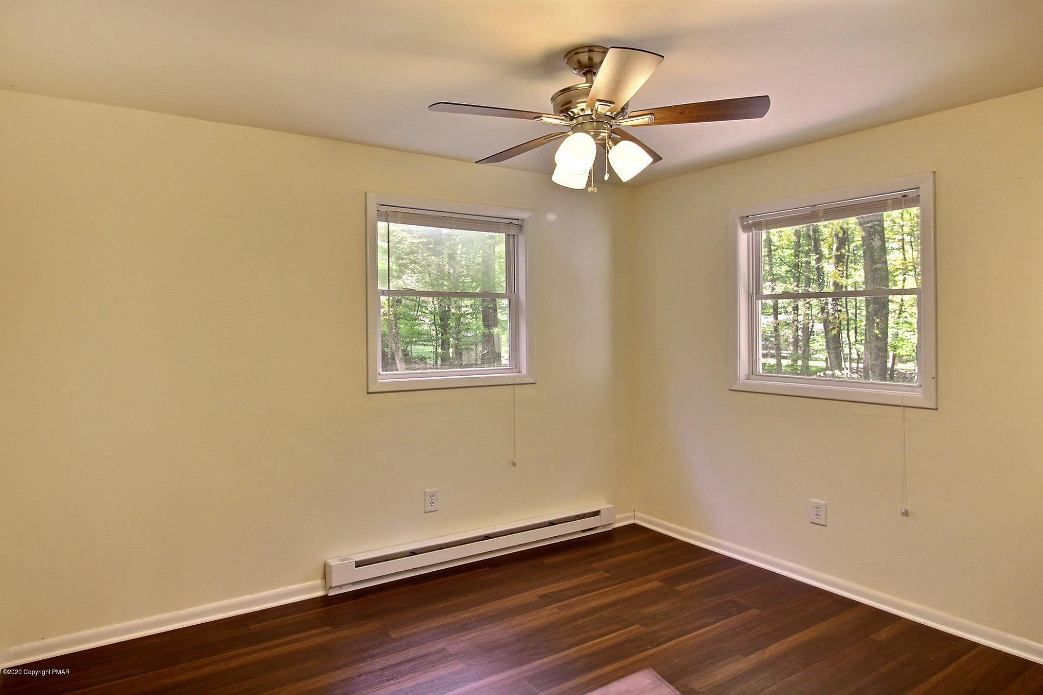 1191 Mattioli Road Bartonsville, PA 18321 - Photo 14 of 17 a view of an empty room with wooden floor and a window