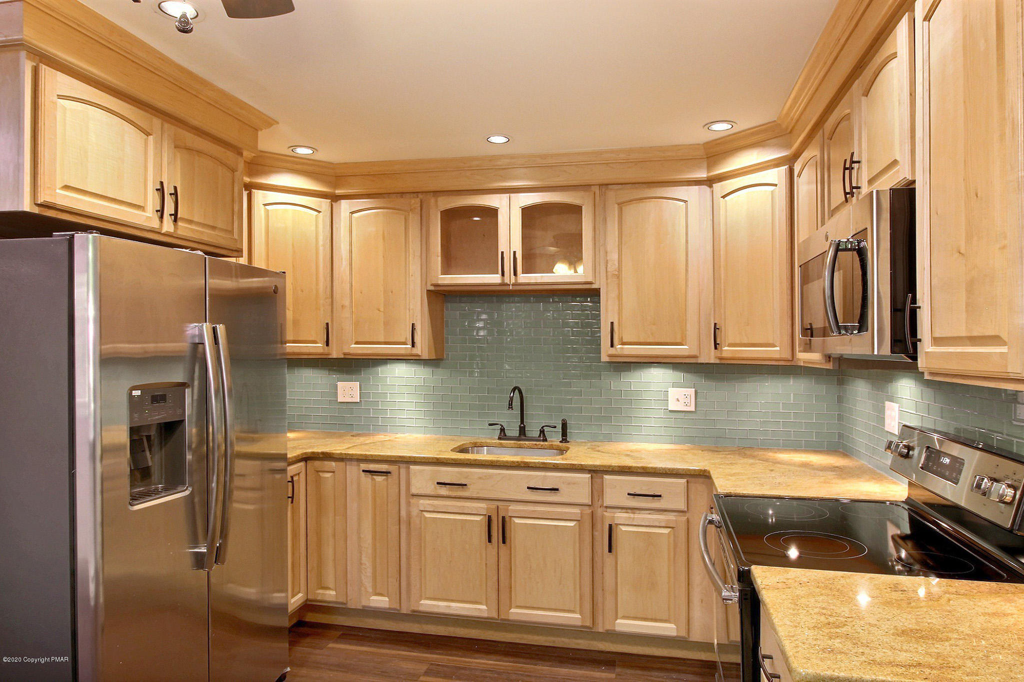 1191 Mattioli Road Bartonsville, PA 18321 - Photo 3 of 17 a kitchen with stainless steel appliances granite countertop a refrigerator a stove and a sink
